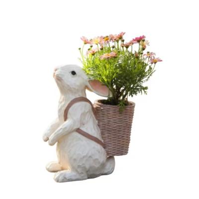 China Europe Wholesale High Quality Resin Wedding Supplies Rabbit Flower Basket For Garden Decoration for sale