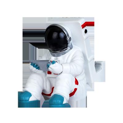 China Global Hot Sale Polyresin Astronaut Mobile Phone Holders Custom Amazon Logo Phone Holders for sale