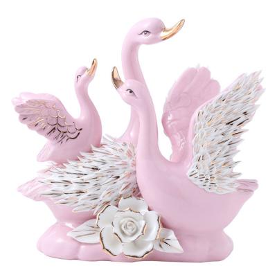 China Europe Decoration Black Swan Design Fantasy Creative Ceramic Wedding Figurine For Wedding Gifts for sale