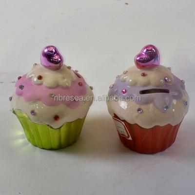 China Ceramic Cheap Pink Cake Coin Bank Cake Shaped Ceramic Money Bank for sale