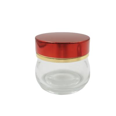 China Personal Care 100G Unique Clear Glass Cosmetics Jar With Gold Foil Cap Empty Bakhoor Jar for sale