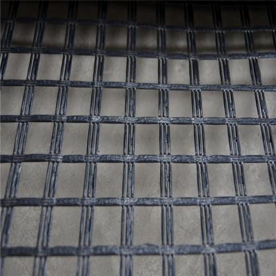 China Industrial Warp Knitted Polyester Geogrid 60-30 kN/m Uniaxial Geogrid /Bridging of Voids and Slumps for sale