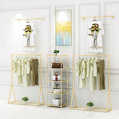 China Beautiful Customized Clothing Boutique Retail Rail Metal Clothing Store Display Rack Garment for sale