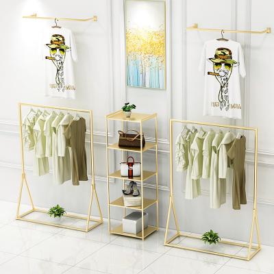 China The beautiful boutique fancy floor garment store racks the display stand rack retail store for clothing for sale