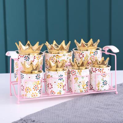 China QYD 7pcs Viable Porcelain Food Candy Spice Jar Gold Crown Lid Kavanoz Storage Bottles And Jars Ceramic Wholesale Airtight Containers for sale