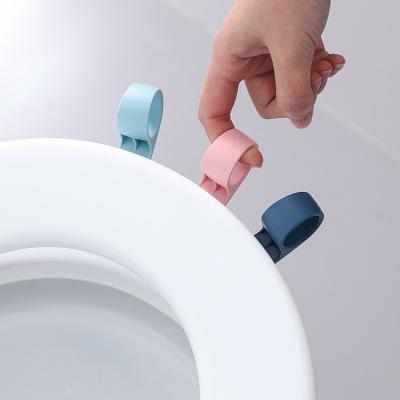 China New Design 2022 Hot Selling Viable Hot Selling Anti-dirty Toilet Seat Lift Sticker Household Hand Lid Lifter Anti-dirty Handle for sale