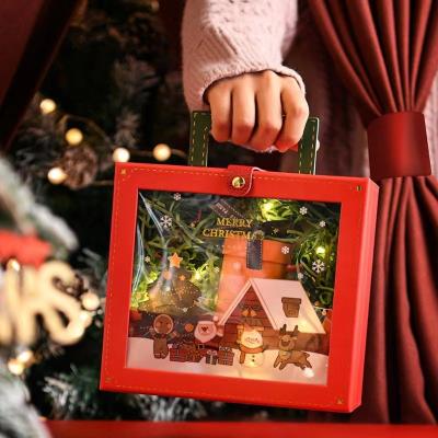 China Christmas Handmade Hard Cardboard Gift Red Packaging Boxes With Fixed Ribbon for sale