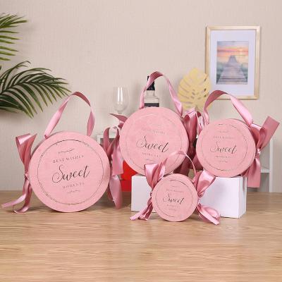 China European Disposable Portable Candy Gift Box Wedding Flocking Favor Round Paper Boxes With Ribbon Bow Candy Box for sale