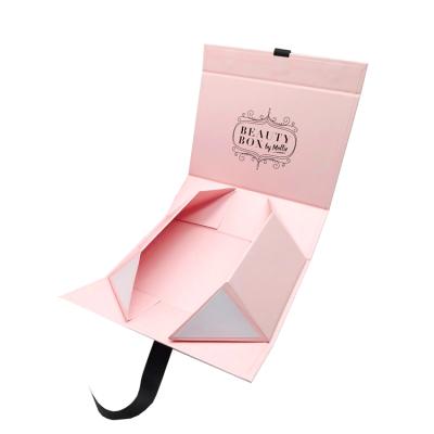 China Waterproof Luxury Pink Book Shaped Foldable Packaging Gift Boxes Flat Pack Ribbon Closures Folding Cardboard Paper Box With Magnetic Lid for sale