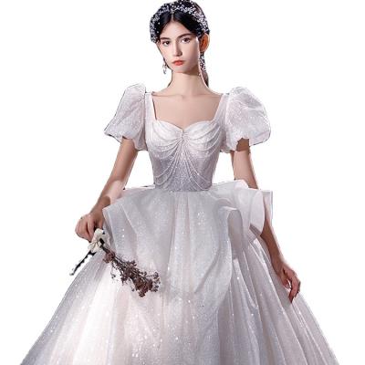 China 2021 New Arrivals Breathable Luxury Bride Princess Dress White Bishop Sleeve Beads Sequin Wedding Dress for sale