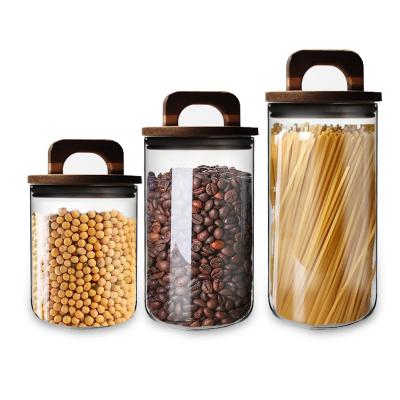 China Wholesale Empty Oats Spice Food Storage Jar Glass Pasta Freshness Preservation Container 550ml 900ml With Acacia Wood Lid for sale