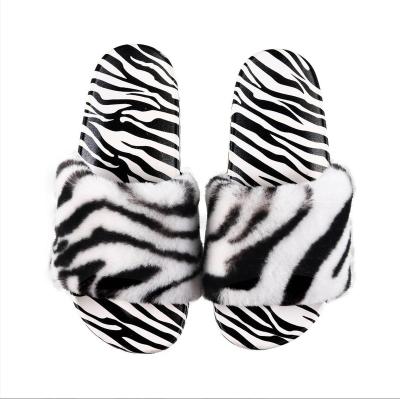 China 2021 Fashion Trend Hot Zebra Printed Fluffy Faux Fur Slides For Ladies Wholesale Women's Flat Plush Fur Indoor Slides Slippers for sale