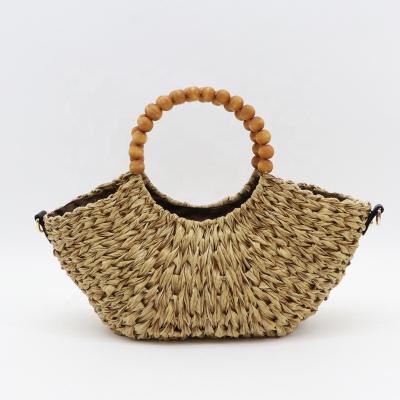 China Handmade ; MBC 2022 New Design Women Beach Rattan Handbags Plastic Casual Sachet Women Handmade Tote Bags With Wooden Bead Handle For Girl for sale