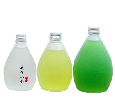 China Juicy Beverage 350ml 500ml Beverage Bottles Frosted Glass Water Bottle With Lid Wholesale for sale