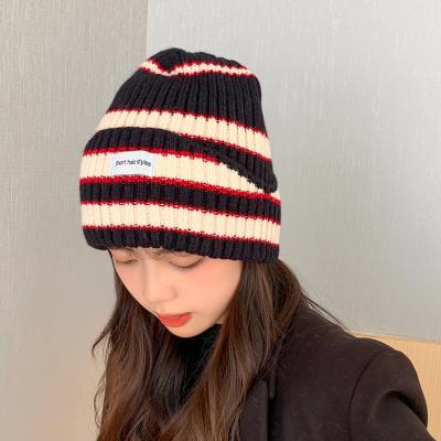 China JOINT Hot Fashion Women Colorful Knitted Beanie Winter Hats With Woven Label for sale