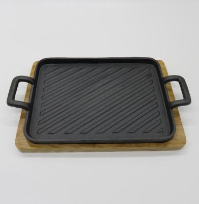 China Sustainable cast iron sizzling dish with wooden base for sale