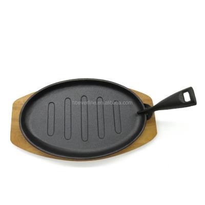 China 10.5 Inch Viable Oval Cast Iron Sizzler Pan With Wooden Base for sale