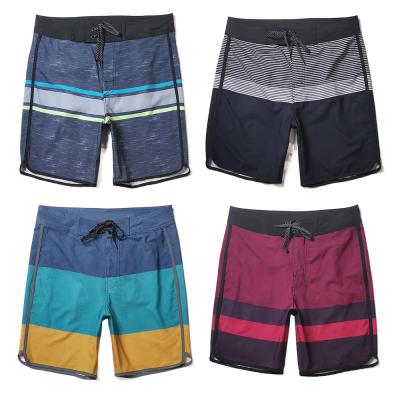 China Custom Logo Men Quick Dry Swim Shorts Breathable Swimwear Trunks Adjust Waist Beachwear Polyester Surf Board Shorts for sale