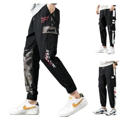 China Autumn Joggers Men Cargo Pants Anti-wrinkle Strap Side Streetwear Men's Sports Tooling Track Pants for sale