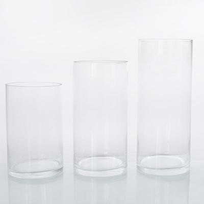 China Traditional Custom Different Size Popular Classic Cylinder Clear Glass Flower Vase For Wedding Decoration for sale