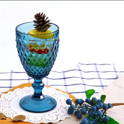 China Sustainable Hot Sale Decoration Vintage 300m Colored Wine Glass Embossed Glass Goblet Cups for sale