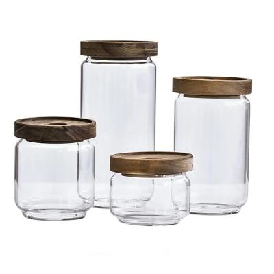 China 4 Pcs Viable One Set High Quality Borosilicate Glass Spice Jar With Acacia Lids Airtight Glass Food Container Set For Food Storage for sale