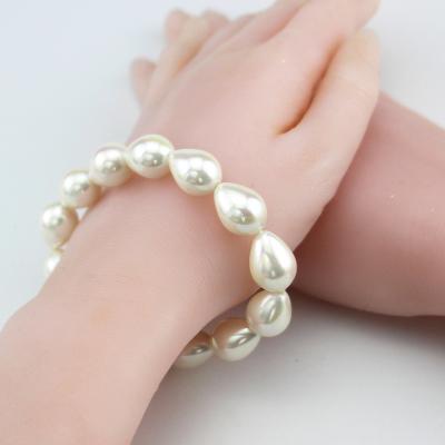 China Naturally Shaped Straight Shell Pearl Water Drop Hole Shell Beads DIY Handmade White Charm Female Bracelet for sale