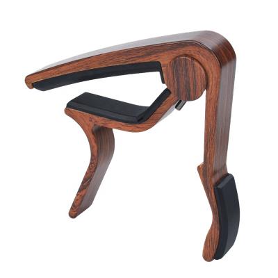 China Guitar capo, electric guitar bass guitar capo, professional musical instrument accessories, various styles of smooth wood for sale