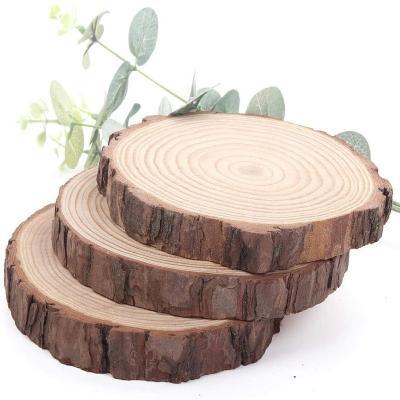 China Nature Unfinished Natural Wood Slices Open Wood Slices With Bark For Crafts for sale