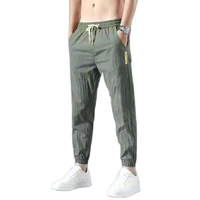 China 2022Quick Men's Loose Elastic Breathable Dry Running Jogging Pants Trousers Fitness Gym Workout Sport Pants Men for sale