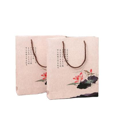 China Eco - Friendly Clothing Paper Bag Kraft Paper Bag With Handle Grocery Paper Bag for sale