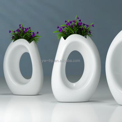 China Large O Shape Flower Pot O Shape Fiberglass Flower Stand Bulk Decoration Hotel Square Mall Garden for sale