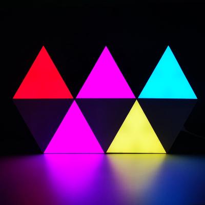 China Colorful WIFI Control 6Pcs Wifi Music Control Dimming RGB Triangle Splicing Modular LED Wall Panels Decorative Indoor LED Background Lighting for sale