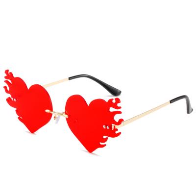 China Fashion Trendy Adult Red Heart Sunglasses And Fire Shaped UV400 Women Party Sunglasses for sale