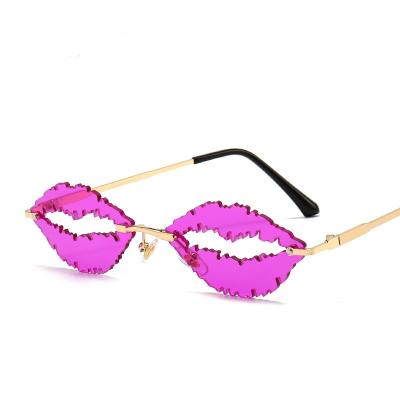 China 2021 Italy Design Rimless Sunglasses New Mouth Sunglasses Fashion Glass Shape Ladies Single Pink Lens For Christmas Party for sale