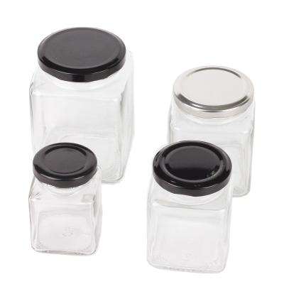 China 100ml 200ml Glass Food Beverage Honey Container Storage Jar Square Spice Candy Glass Jar With Metal Lids for sale