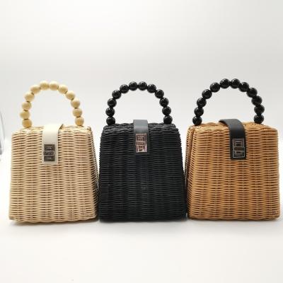 China 100% eco-friendly handmade wicker straw bag weave shoulder rattan bags with pearl handle for sale