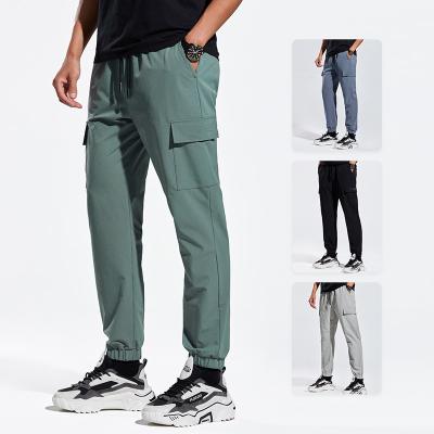 China Wholesale Plus Size Empty Track Pants Mens Gym Sweatpants Streetwear Cargo Joggers Casual Elastic Pants With Side Pockets for sale