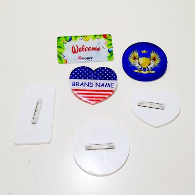 China Custom Plastic Resin Acrylic Button Blank Europe Sublimation Badge Name Tag Wholesale for sale