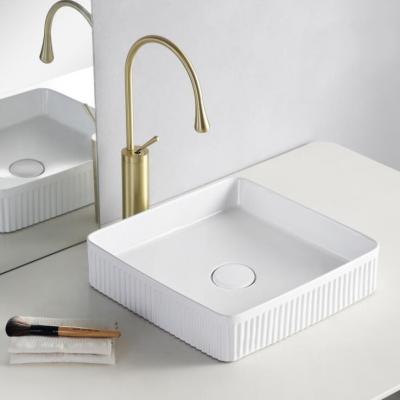 China Modern Elegant White Ceramic Luxury Ceramic Bathroom Basins Table Top Hand Wash Basin for Bathroom for sale