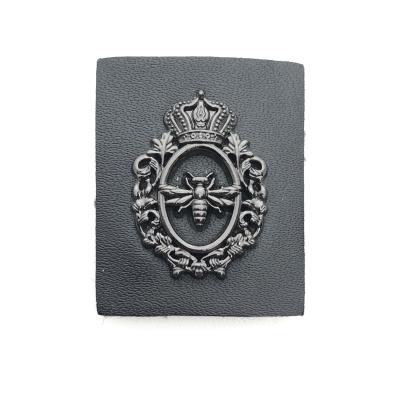 China Good Viable Wholesale Price Little Black Leather Metal Logo Crown Bee Patch Labels for sale