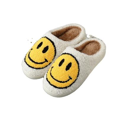 China Cushioning 2022 Wholesale Cute Winter Smiley Face Slipper Warm Plush Smiley Face Indoor Home Slippers For Women Fit Fluffy Slippers for sale