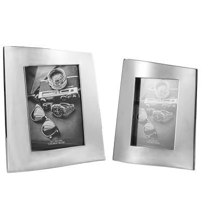 China 304 Stainless Steel Silver 304 Stainless Steel Photo Frame Light Luxury Custom Photo Frame Light Luxury Hotel Office/Bedroom 7 Inch Leather Photo Frame for sale