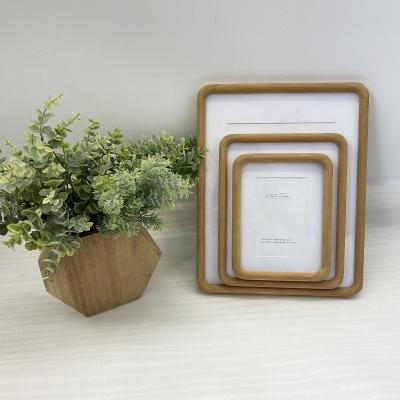 China Contemporary wholesale handmade paper wood photo wall frames for photos picture home dector for sale