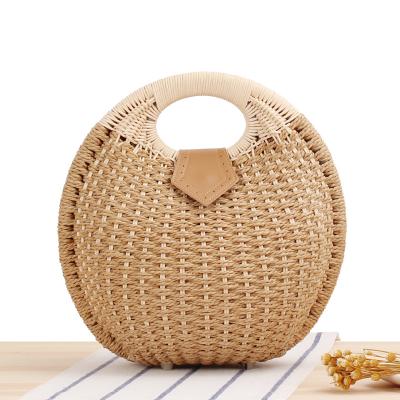 China New top grade high quality round woven straw makeup bag straining handmade ladies fashion purses bag for sale