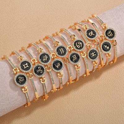 China Latest Fashion 12 Design Zodiac Bracelet Gold Color Diamond Pendant Charm Bangle Bracelet for sale