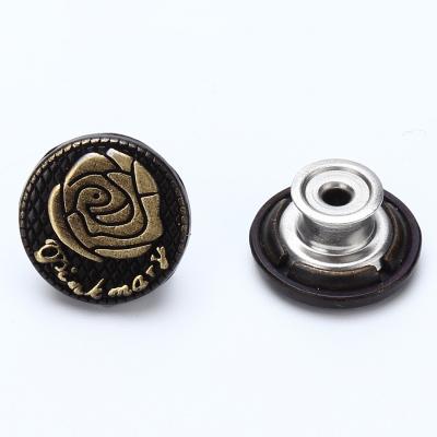 China Custom embossed dry cleaning flower shape single pin metal jeans buttons on sale from jeans factory directly for sale