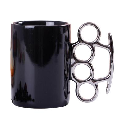 China Fist Knuckle Gift Viable Creative Giled Ceramic Mug Plated Silver Handle Large Capacity Coffee Mug for sale