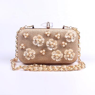 China Evening Clutch Purse Fancy Gold Pearl Flower Crystal Decorated Wedding Purse for sale