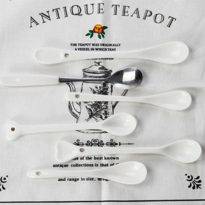 China Viable White Luxury Bone China Tea Spoon Long Handle Ceramic Milk Coffee Scoops Honey Spoons for sale